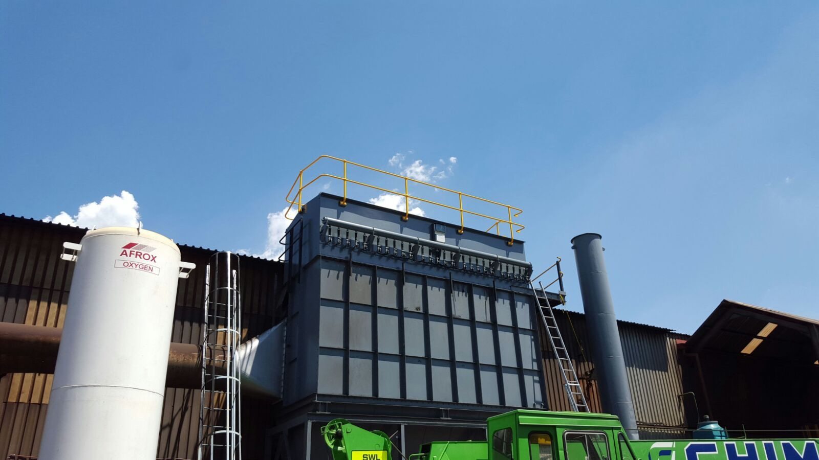 Dust collector outside a foundry finishing area